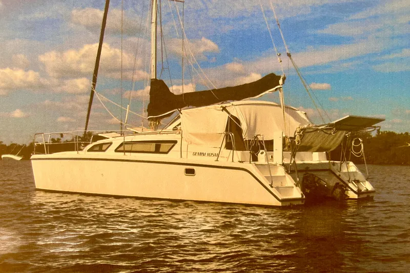 The Image of Sailboat on water, PCI 105 MC model, 2009, under a partly cloudy sky. - 1