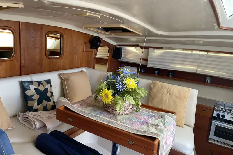 Slide: The Image of Interior of 2009 PCI 105 MC yacht with cozy seating and floral centerpiece. - 12