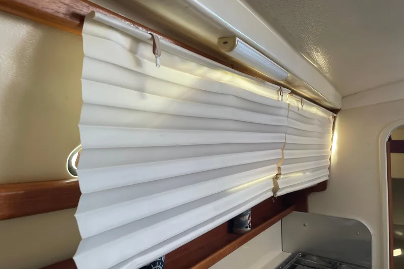 Slide: The Image of White pleated blinds in a PCI 105 MC boat interior, 2009 model. - 24