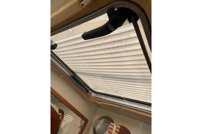 Slide: The Image of Interior view of a PCI 105 MC 2009 model, featuring a window and handle. - 32