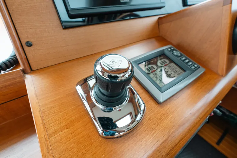 Slide: The Image of Joystick control and display panel on 2011 Grand Banks 46 Eastbay SX yacht dashboard. - 8