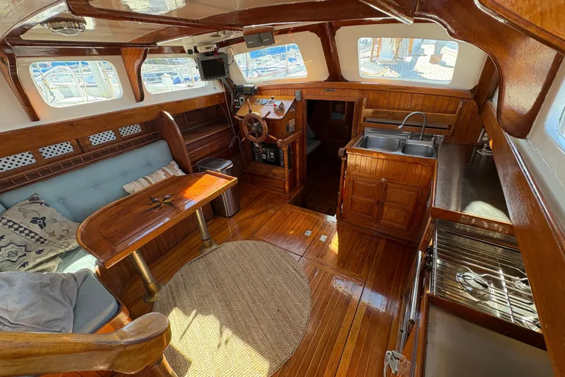Slide: The Image of Interior of a 1979 Formosa 51 yacht with wooden furnishings and nautical decor. - 20