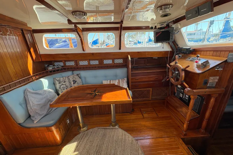 Slide: The Image of Interior of a 1979 Formosa 51 sailboat with wooden furnishings and nautical decor. - 31