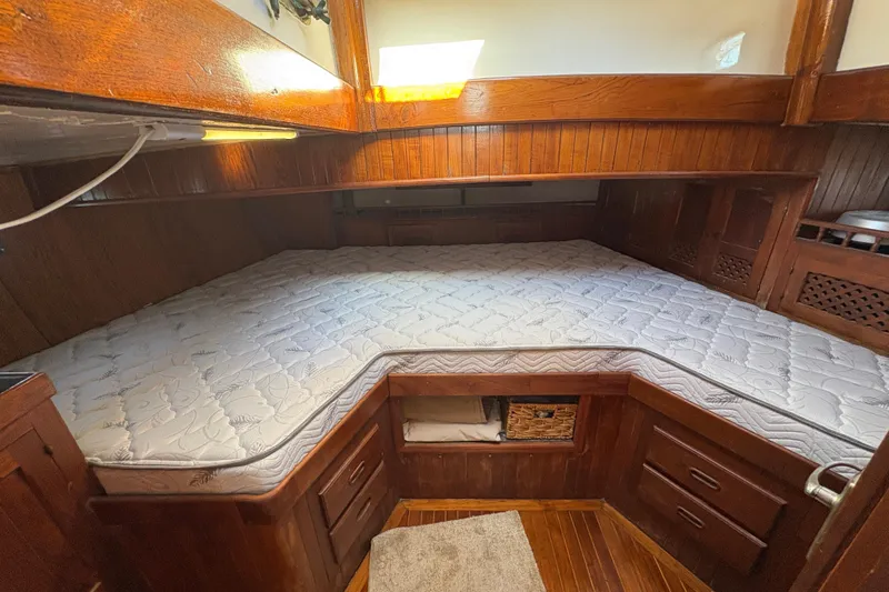 Slide: The Image of Cozy wooden cabin interior of 1979 Formosa 51 yacht with a comfortable bed. - 33