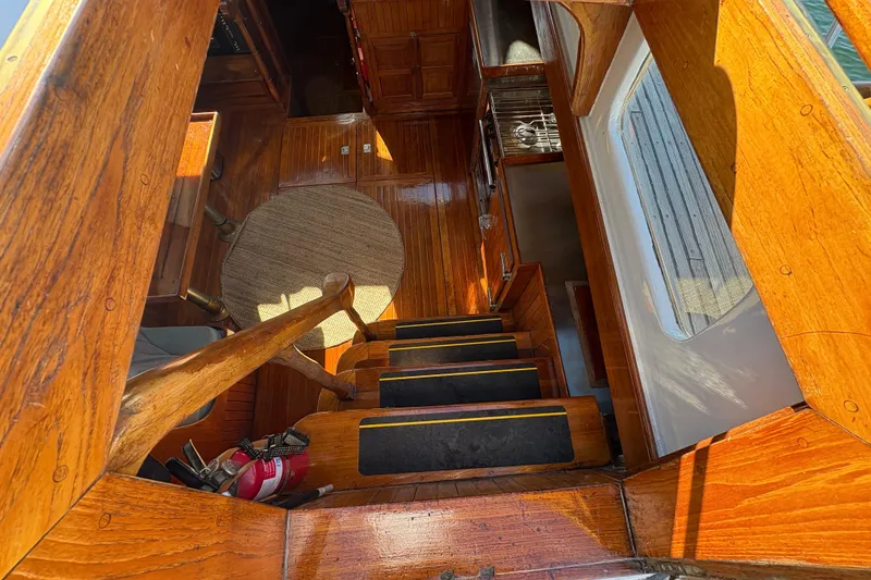 Slide: The Image of Interior view of 1979 Formosa 51 sailboat with wooden stairs and flooring. - 37