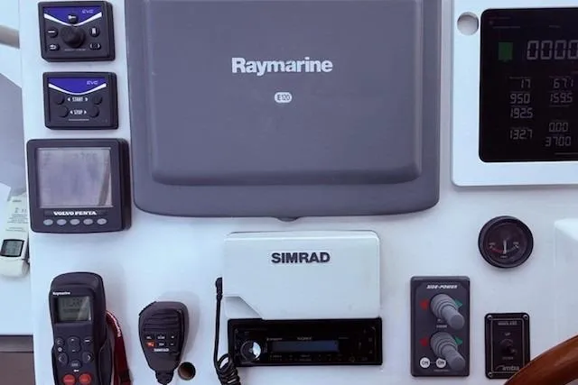 Slide: The Image of Control panel of a 2007 Navigator 58 yacht with Raymarine and Simrad equipment. - 18