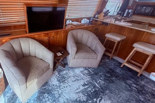 Slide: The Image of Interior of 2007 Navigator 58 yacht with cozy seating and modern decor. - 2