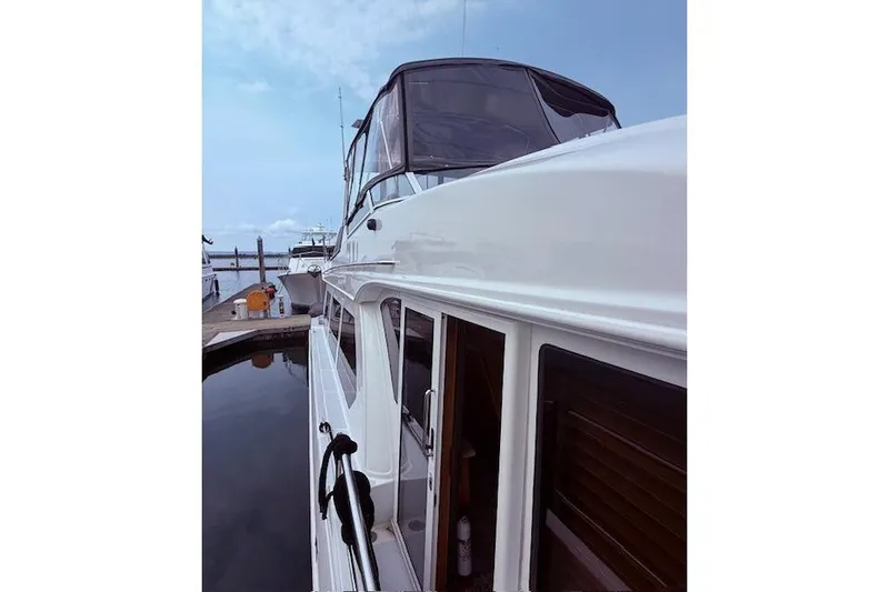 Slide: The Image of 2007 Navigator 58 yacht docked at marina under clear sky. - 21