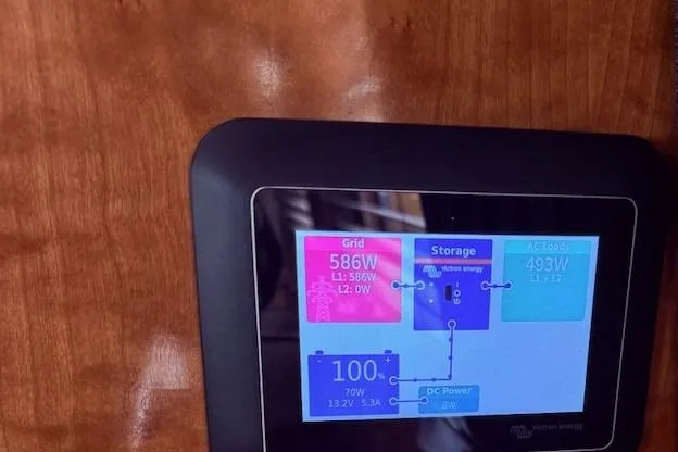 Slide: The Image of Touchscreen energy monitor on 2007 Navigator 58, displaying grid, storage, and power usage data. - 23