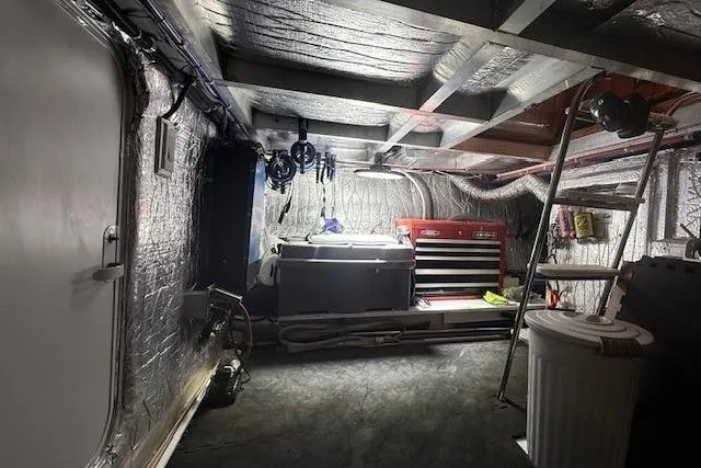 Slide: The Image of Engine room of a 2007 Navigator 58 yacht with tools and equipment. - 28