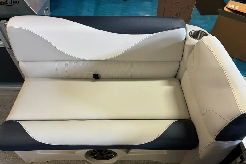 Slide: The Image of 2025 Avalon Venture Cruise Rear Bench with cup holder, featuring elegant white and navy upholstery. - 3