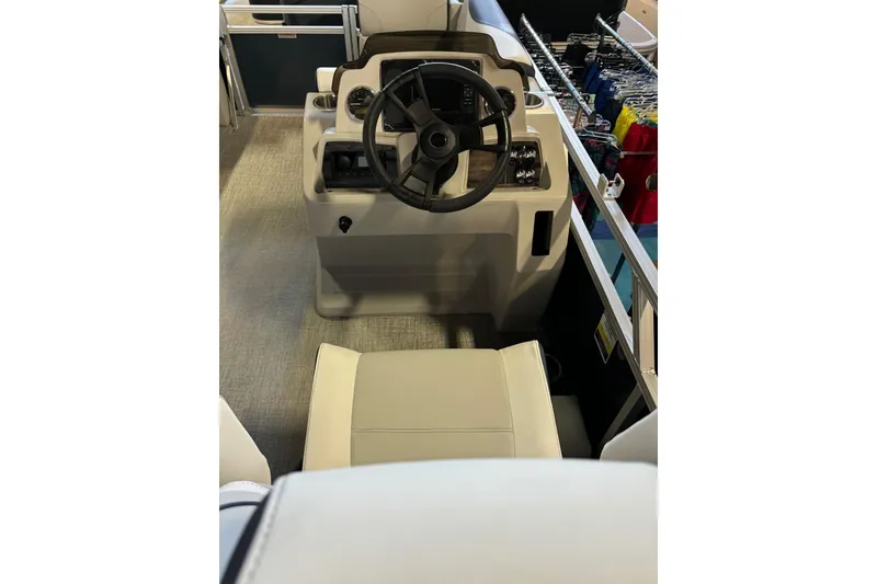 Slide: The Image of Interior of 2025 Avalon Venture Cruise Rear Bench boat with steering console and seating. - 4