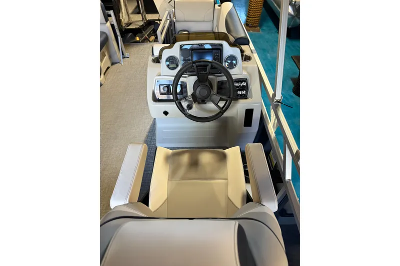 Slide: The Image of 2025 Avalon Venture Cruise Rear Bench boat interior with steering wheel and seating. - 7