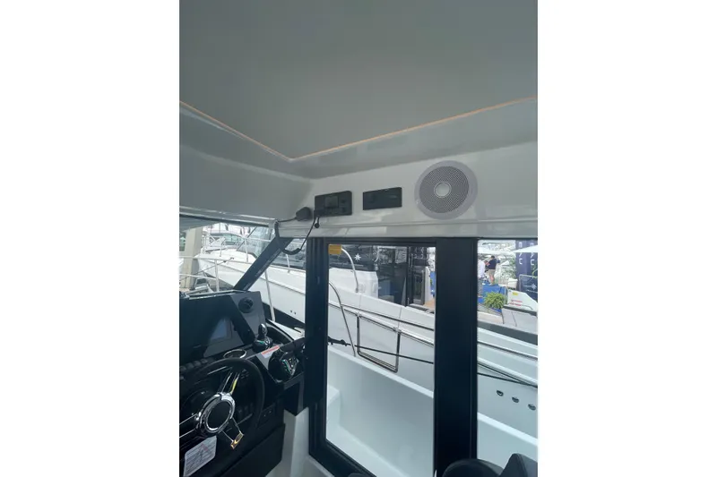 Slide: The Image of Interior view of 2026 Jeanneau NC 1095 Fly Series 2 boat cockpit. - 10