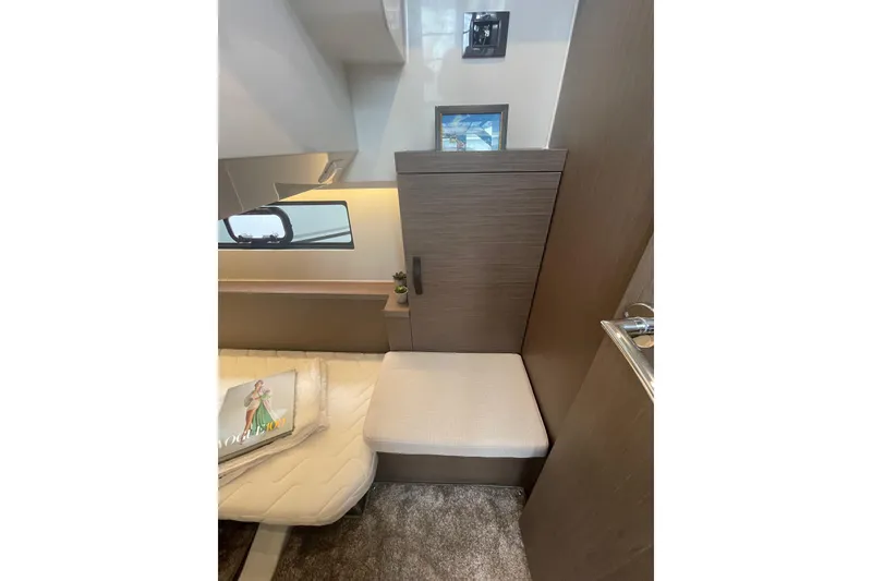 Slide: The Image of Interior of 2026 Jeanneau NC 1095 Fly Series 2, featuring cozy seating and modern decor. - 17