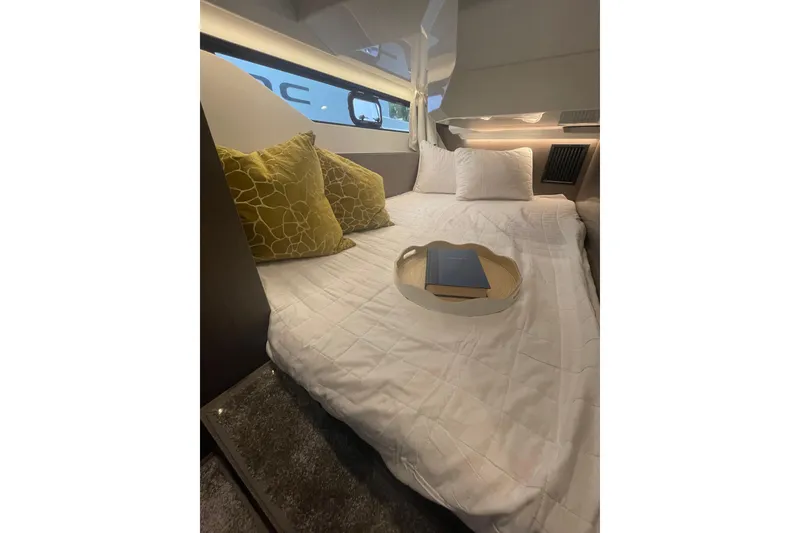 Slide: The Image of Luxurious cabin interior of 2026 Jeanneau NC 1095 Fly Series 2 with cozy bedding. - 19