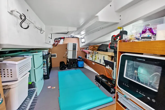 Slide: The Image of Interior cabin of 2026 Jeanneau NC 1095 Fly Series 2 with round bed and window. - 34