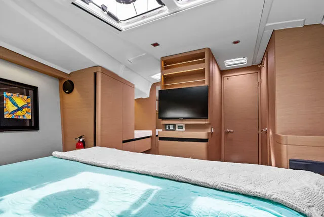 Slide: The Image of Interior cabin of 2026 Jeanneau NC 1095 Fly Series 2, featuring cozy bedding and modern design. - 43