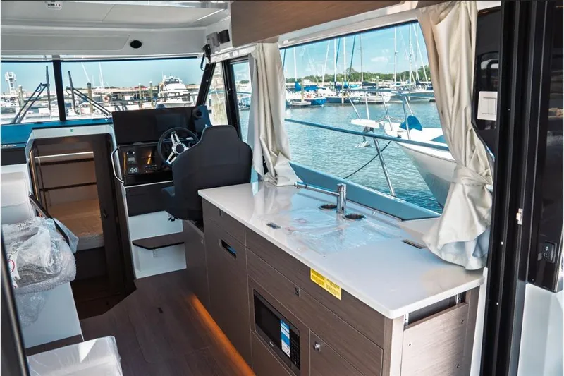 Slide: The Image of 2026 Jeanneau NC 1095 Fly Series 2 boat with twin Yamaha 300 engines at marina. - 49