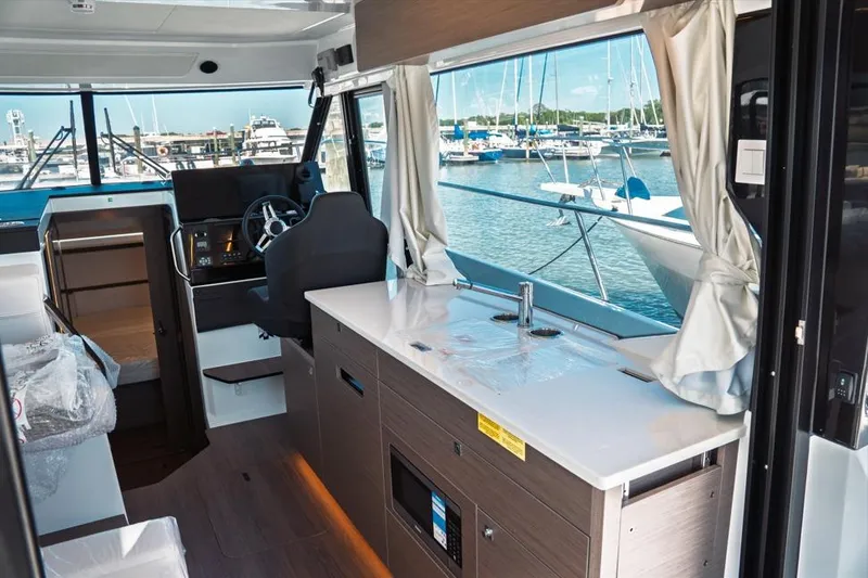 Slide: The Image of 2026 Jeanneau NC 1095 Fly Series 2 yacht docked at marina under cloudy sky. - 50