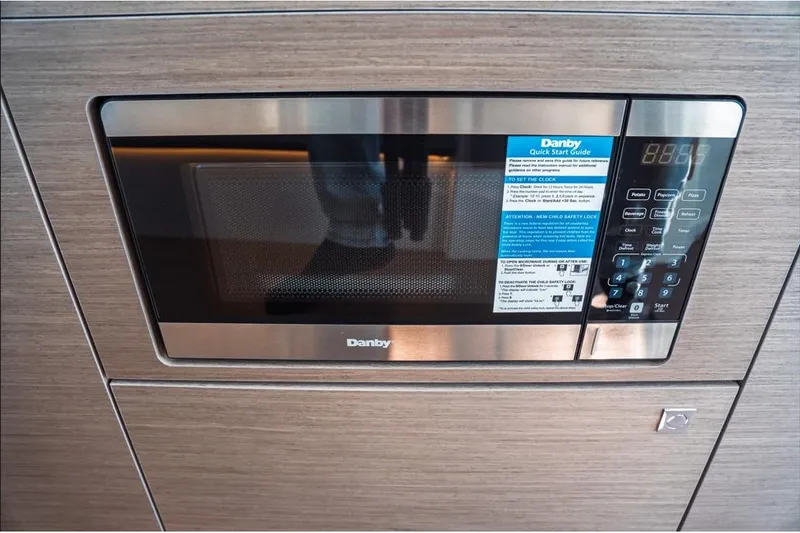 Slide: The Image of 2026 Jeanneau NC 1095 Fly Series 2 boat deck with seating and table. - 53