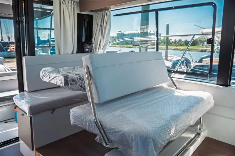 Slide: The Image of Interior view of 2026 Jeanneau NC 1095 Fly Series 2 boat cockpit. - 59
