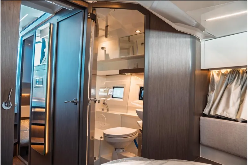 Slide: The Image of Open fridge in Jeanneau NC 1095 Fly Series 2, 2026 model, with cozy interior design. - 67