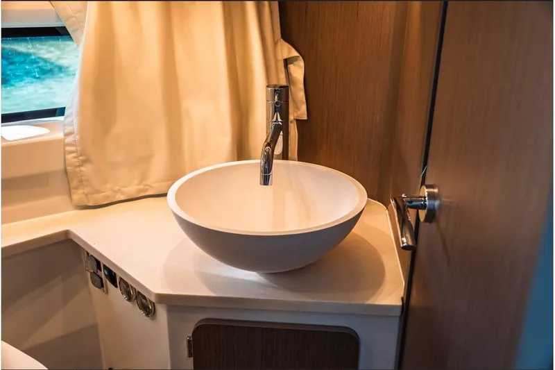 Slide: The Image of Luxurious cabin interior of 2026 Jeanneau NC 1095 Fly Series 2 with cozy bedding. - 68