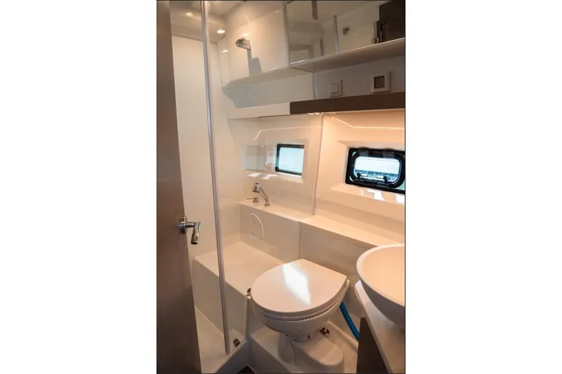 Slide: The Image of 2026 Jeanneau NC 1095 Fly Series 2 yacht interior with modern kitchen and ocean view. - 70