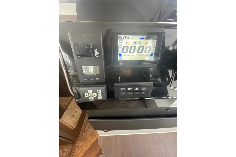 Slide: The Image of Control panel of 2026 Jeanneau NC 1095 Fly Series 2 boat, featuring digital display. - 9