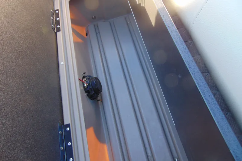 Slide: The Image of 2024 Sun Tracker Fishin' Barge 20 DLX storage compartment interior view. - 23