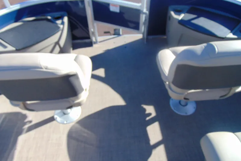 Slide: The Image of 2024 Sun Tracker Fishin' Barge 20 DLX interior with two swivel seats. - 24