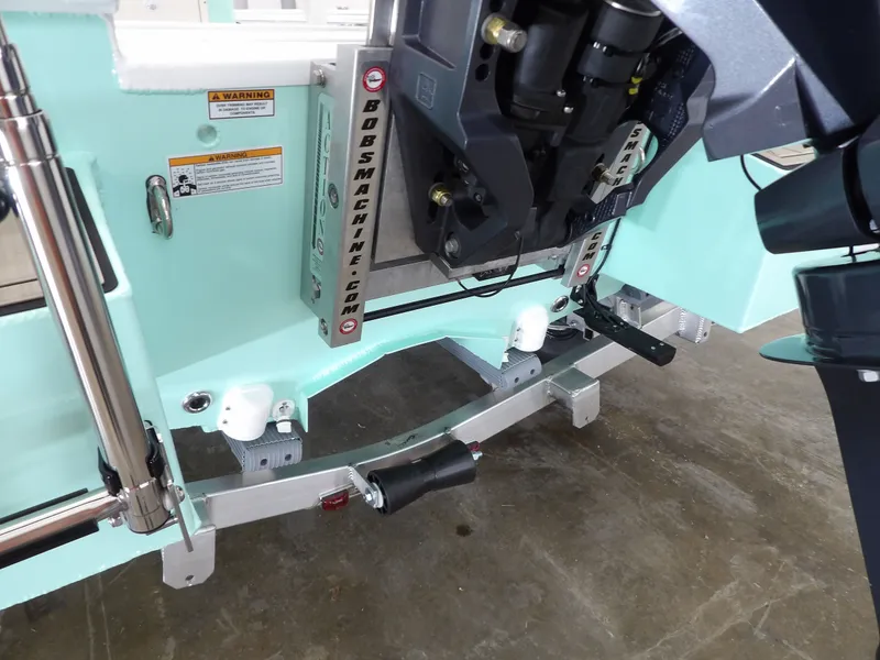 Slide: The Image of Avid 21FST 2026 boat transom with motor mount and warning labels. - 10