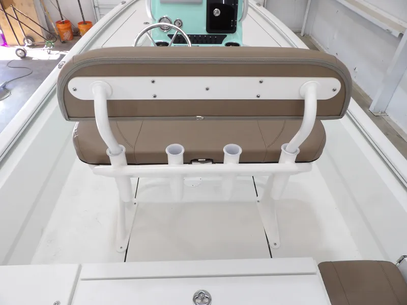 Slide: The Image of 2026 Avid 21FST boat interior with tan seating and rod holders. - 22