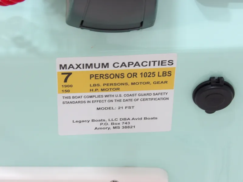 Slide: The Image of Boat capacity label for Avid 21FST, 2026 model, showing maximum 7 persons or 1025 lbs. - 24