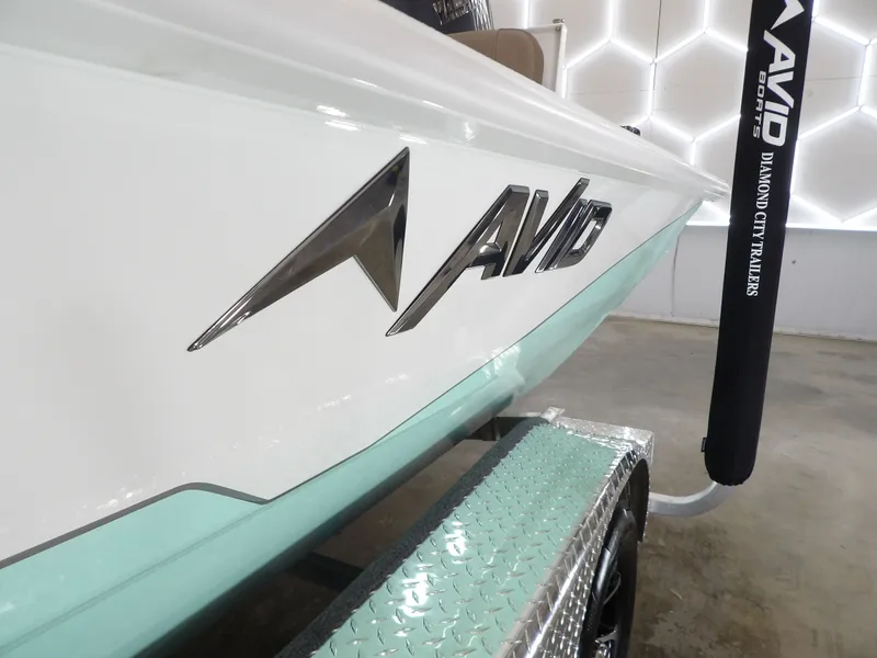 Slide: The Image of Avid 21FST 2026 boat on trailer, featuring sleek design and branding. - 6