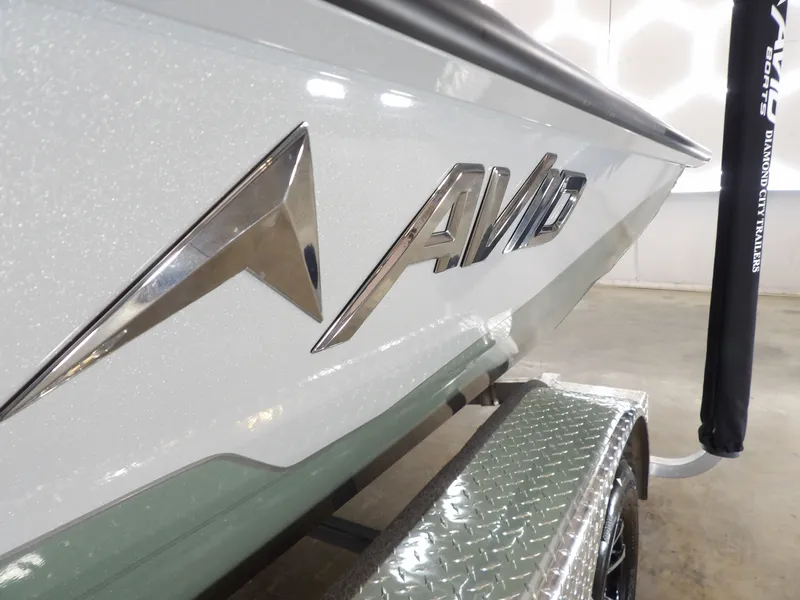 Slide: The Image of Avid 21FST 2026 boat with sleek design and metallic logo on trailer. - 13
