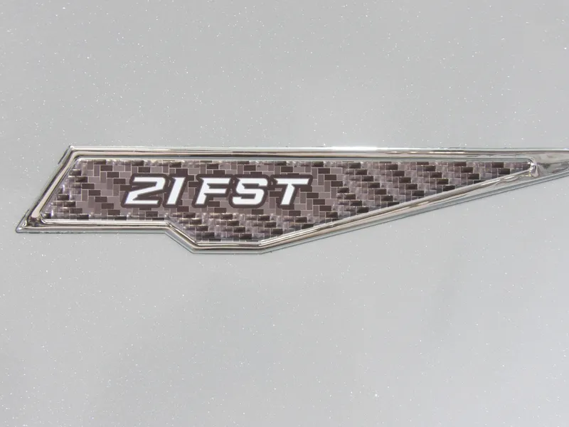 Slide: The Image of Avid 21FST 2026 model badge with carbon fiber design on a metallic background. - 14