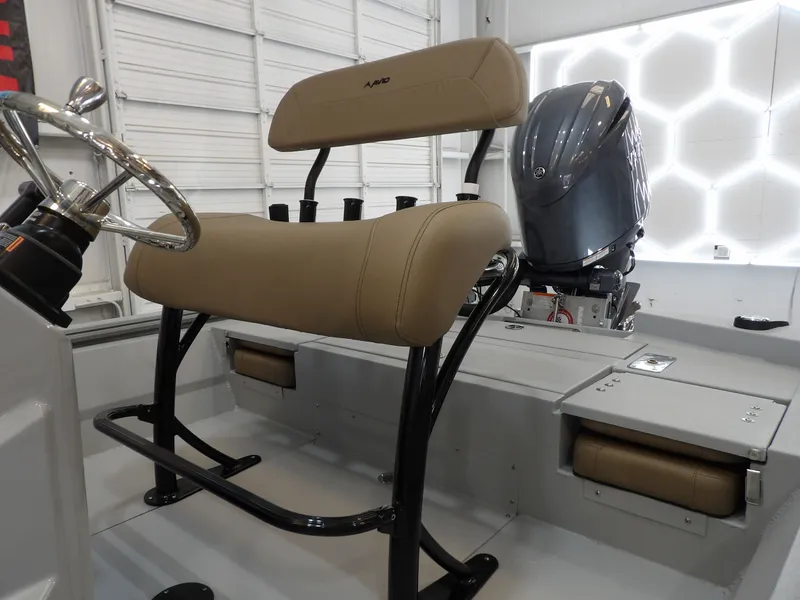 Slide: The Image of 2026 Avid 21FST boat interior with tan seating and modern steering wheel. - 15