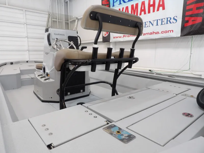 Slide: The Image of 2026 Avid 21FST boat interior with Garmin console and seating, displayed at Yamaha center. - 18