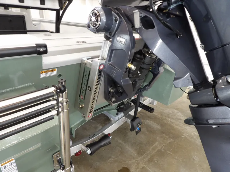 Slide: The Image of Avid 21FST 2026 boat motor and transom detail with ladder and hydraulic components. - 20