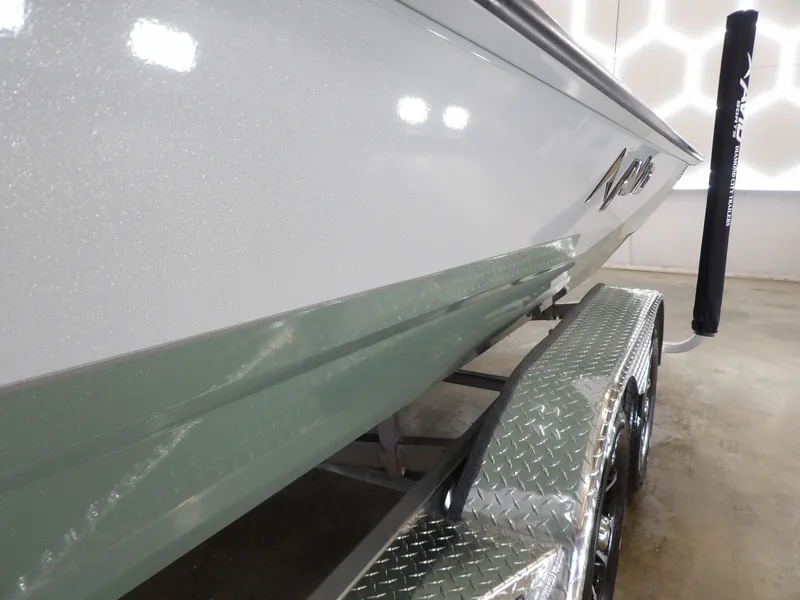 Slide: The Image of 2026 Avid 21FST boat on a trailer, showcasing sleek design and metallic finish. - 24
