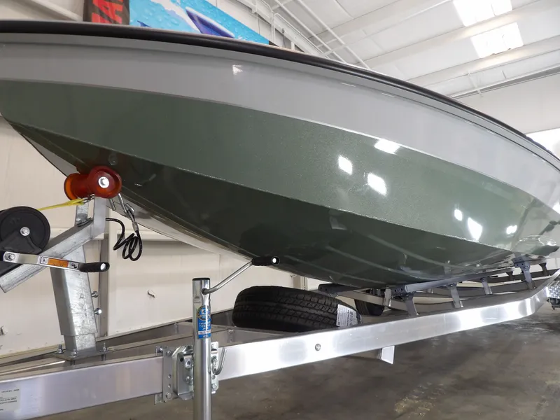 Slide: The Image of 2026 Avid 21FST boat on trailer in indoor showroom. - 5