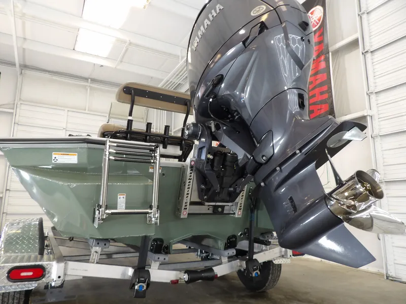 Slide: The Image of Avid 21FST 2026 boat with Yamaha outboard motor in a garage setting. - 7