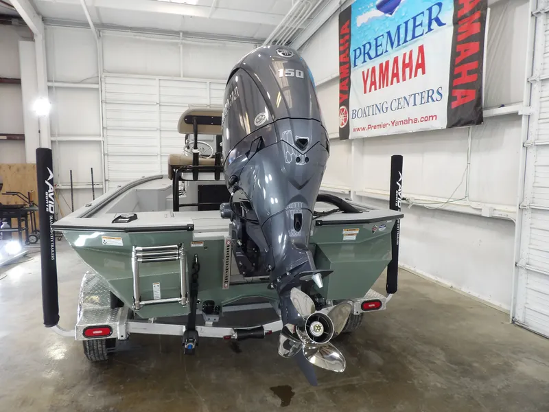 Slide: The Image of Avid 21FST 2026 boat with Yamaha 150 engine in showroom. - 8
