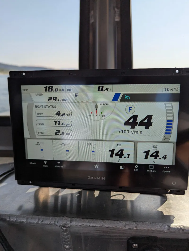 Slide: The Image of Boat navigation display showing speed, RPM, and status on a Northshore 24, 2025 model. - 28