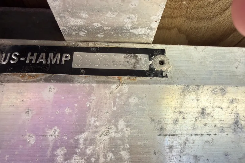 Slide: The Image of Close-up of a 2021 Harris Cruiser 210 boat identification plate with visible serial number. - 18