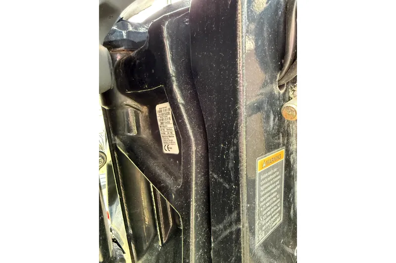 Slide: The Image of Close-up of a 2021 Harris Cruiser 210 boat's identification and warning labels. - 19