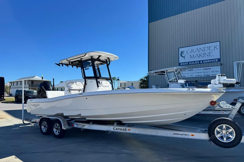 The Image of 2026 Caymas 28 HB boat on trailer at Grander Marine dealership. - 1