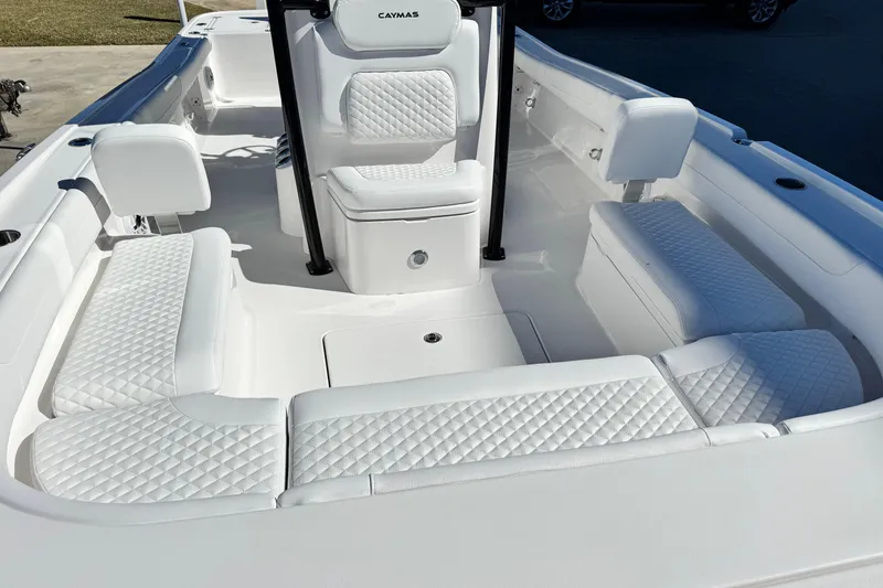 Slide: The Image of 2026 Caymas 28 HB boat interior with white quilted seating and modern design. - 13